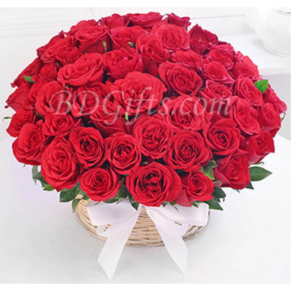 50 pure red roses in a basket