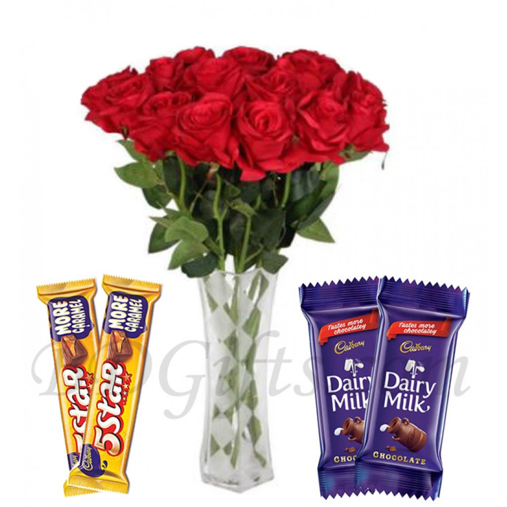 roses in vase with chocolates
