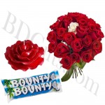 red roses with chocolates and candle