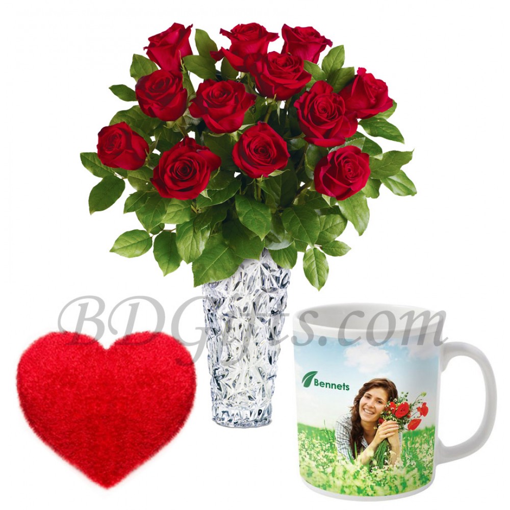 Roses in vase with mug and pillow