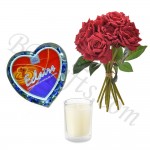 Red roses in bouquet with heart shape chocolate box and glass candle