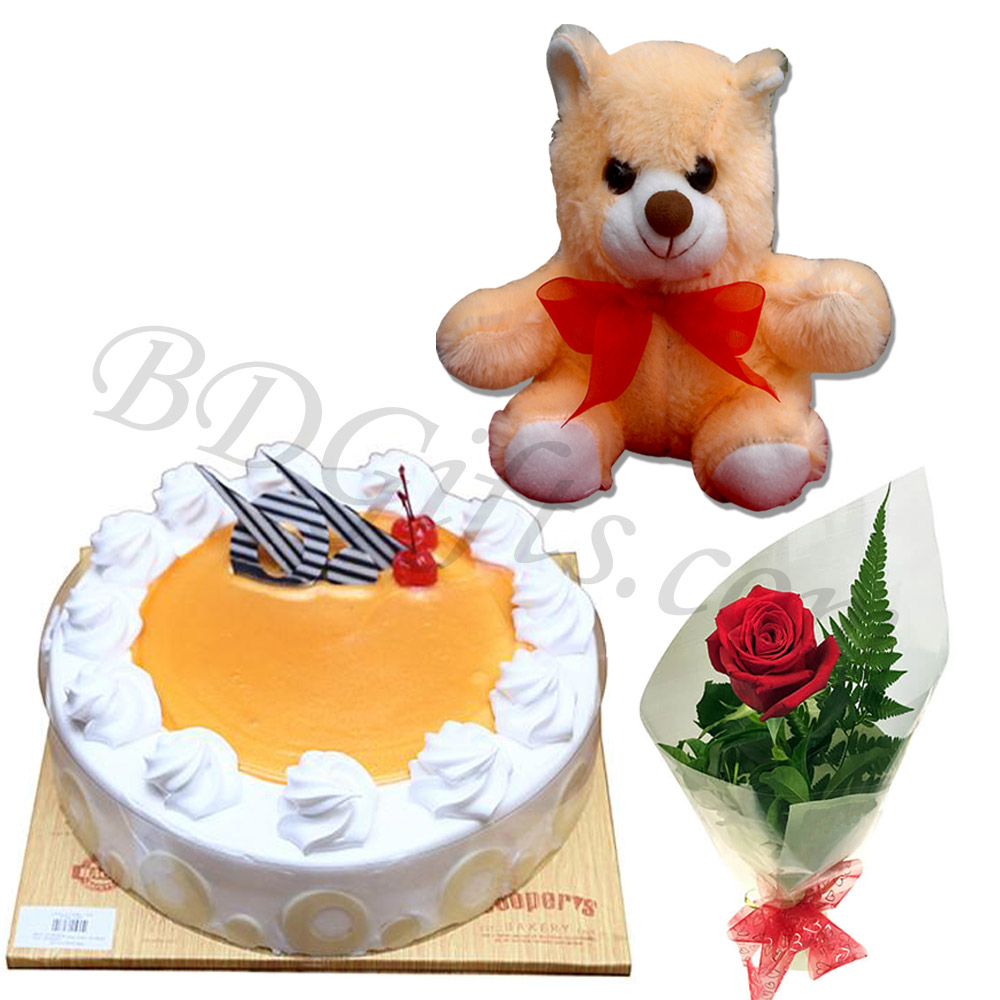 Cake, teddy bear and single red rose in bouquet